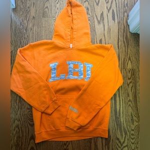 Orange and blue lbi cloud hoodie from hazel boutique nj